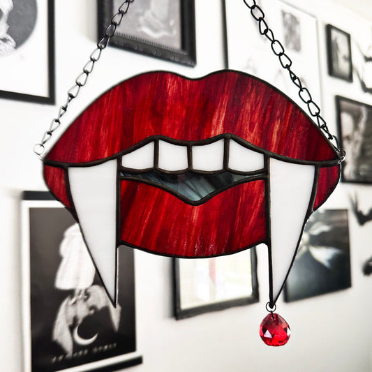 Red Marble Vampire Teeth Suncatcher